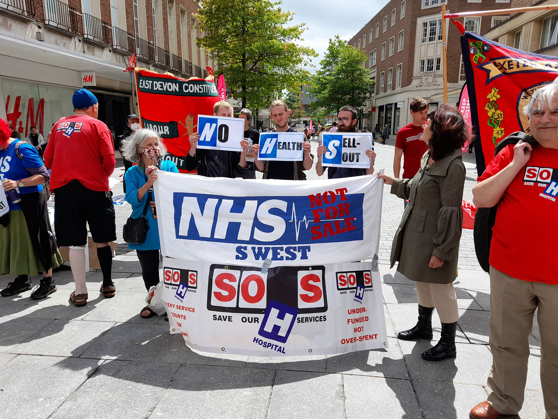 SOHS and KONP protesters with a banner which says NHS not for Sale South West